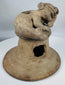 Ancient Manteño terracotta ceremonial vessel lid with stylized human figure and ritual incense vents.