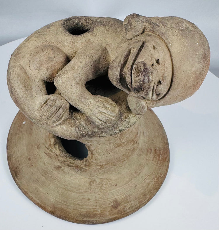 Hand-modeled Pre-Columbian Ecuadorian terracotta incensario with ritual vent openings and anthropomorphic decoration.