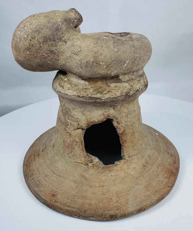 Pre-Columbian terracotta incensario from Ecuador with expressive anthropomorphic sculpture and weathered archaeological surface.