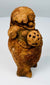 Maya Late Classic ceramic rattle with short standing legs, applied arms, and mineral deposits