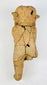 Detail view highlighting facial features and surface texture of a Pre-Columbian figurine