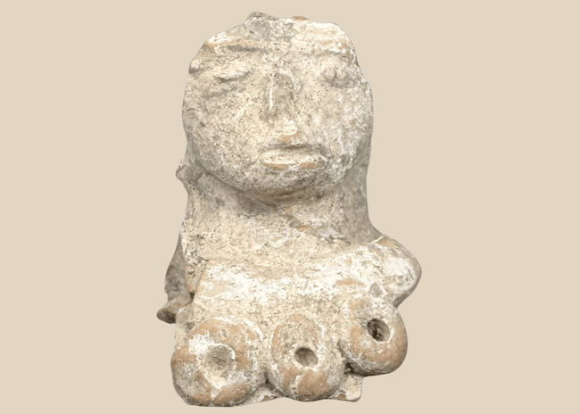 Pre-Columbian terracotta female figure fragment with prominent headdress and stylized facial features, Mesoamerica, circa 300 BCE–600 CE.