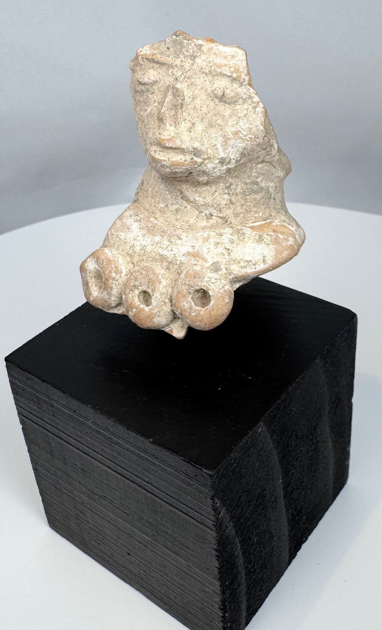 Ancient Gulf Coast Mexico terracotta female sculpture fragment featuring symbolic fertility attributes.