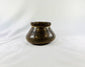 Pre-Columbian Mesoamerican pottery vessel showing painted polychrome patterns and rounded body shape.