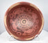 Pre-Columbian Nariño ceramic vessel with painted interior decoration, stylized monkeys, and patterned rim border.