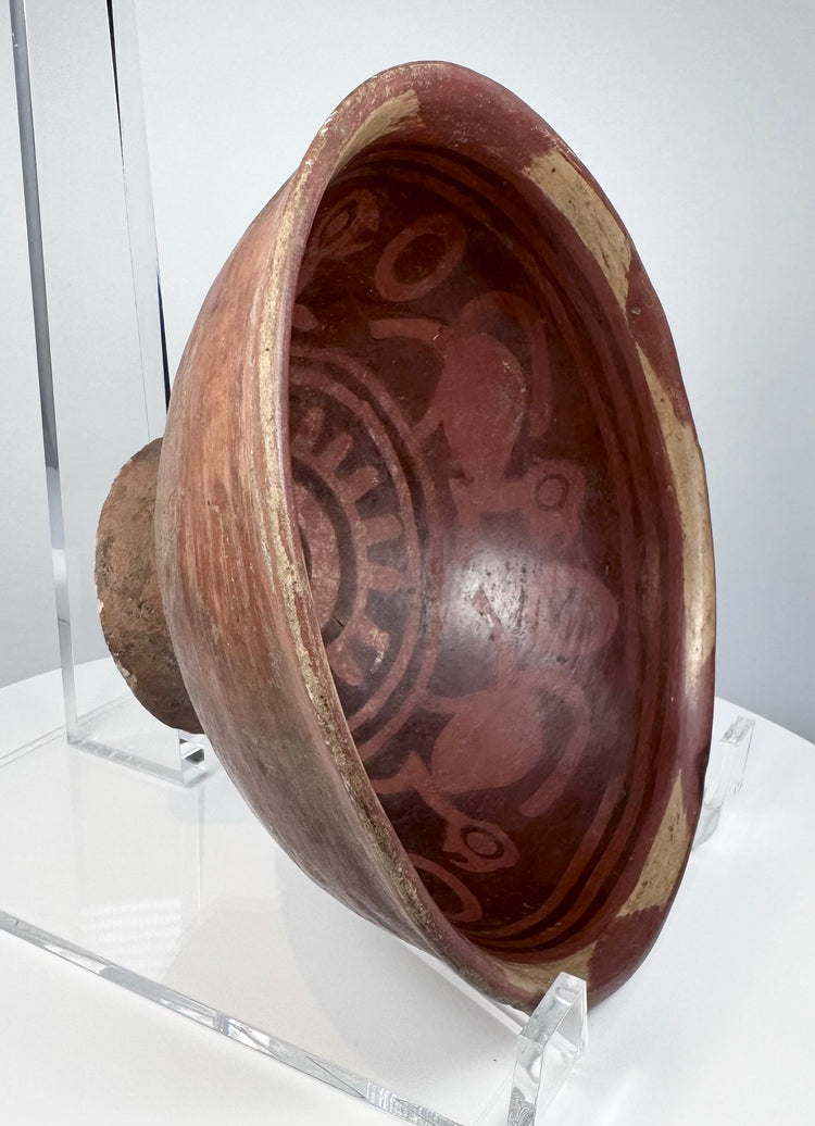 Pre-Columbian Nariño pottery bowl from Colombia or Ecuador, circa 800–1500 CE, with red and cream bichrome decoration.