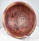 Nariño culture ceremonial pottery bowl with intricate negative resist designs, bichrome coloring, and monkey motifs.