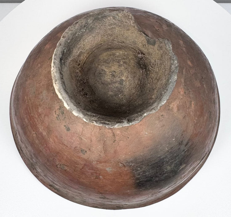 Ancient Andean terracotta bowl from the Nariño culture showing finely executed negative resist geometric patterns.