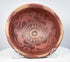 Historic Nariño pottery bowl from northern South America displaying detailed bichrome surface decoration and aged patina.