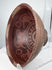 Ancient Nariño terracotta bowl featuring four stylized monkey motifs and geometric negative resist decoration.