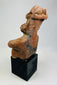 Reverse angle of Nayarit ceramic figure highlighting form and age-appropriate encrustations.