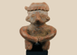 Ancient Nayarit terracotta seated figure from West Mexico Shaft Tomb tradition on a black museum stand