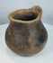 Pre-Columbian earthenware mug attributed to the Casas Grandes culture, showcasing the craftsmanship of ancient northern Mexico.