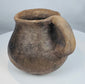 Pre-Columbian Casas Grandes ceramic vessel with rounded body, sturdy handle, and evidence of traditional indigenous pottery techniques.
