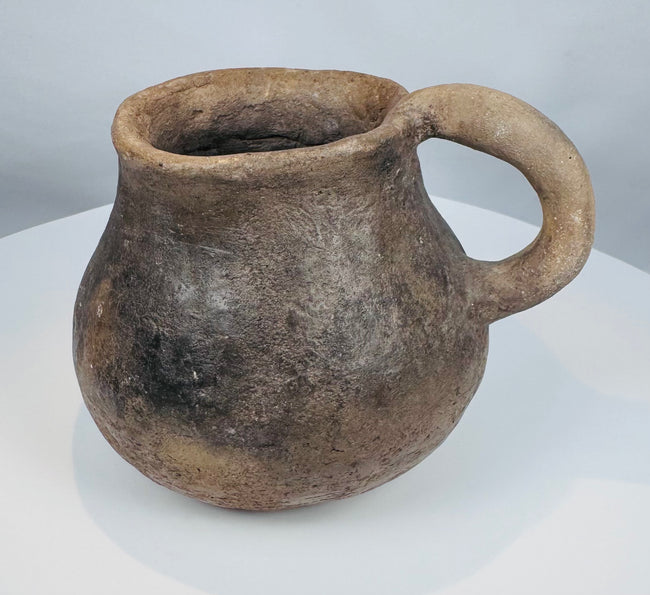 Casas Grandes pottery mug from the Chihuahua region of Mexico, hand-formed from earthenware and preserved with centuries of wear.
