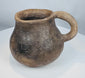 Casas Grandes pottery mug from the Chihuahua region of Mexico, hand-formed from earthenware and preserved with centuries of wear.
