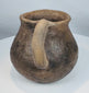Ancient northern Mexican pottery mug from the Paquimé culture featuring a smooth earthenware surface and functional utilitarian design.