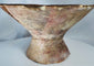 Hand-painted ancient ceramic vessel with elevated footed base and traditional geometric decoration.