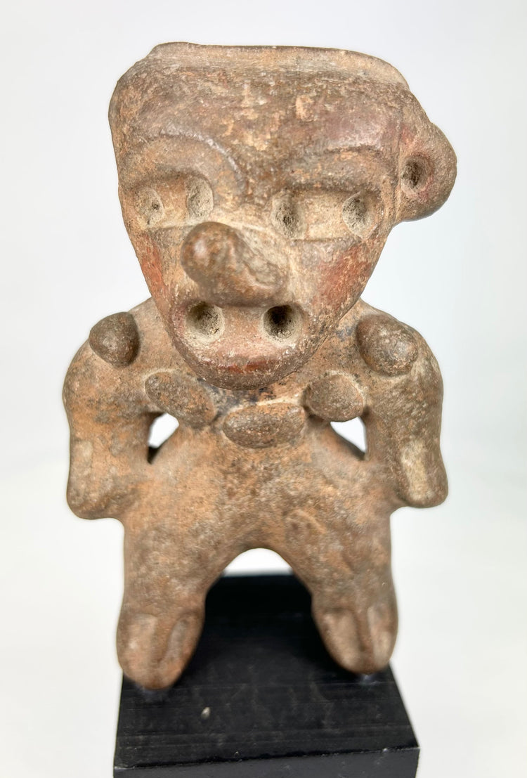 Ancient West Mexican terracotta standing figure mounted for museum-style display