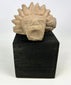 Ancient stone animal head sculpture fragment with jaguar-like features