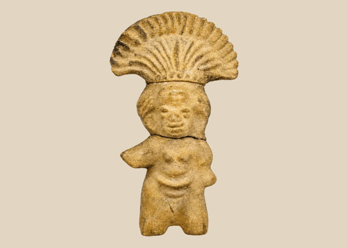 Ancient Pre-Columbian terracotta figurine depicting a standing figure with a wide fan-shaped headdress, stylized facial features, and rounded body, handmade from earthen clay, dating between 500–1500 CE, representing ceremonial or ritual iconography of Mesoamerican cultures.