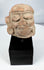 Weathered Pre-Columbian terracotta head fragment with burial accretions and surface patina