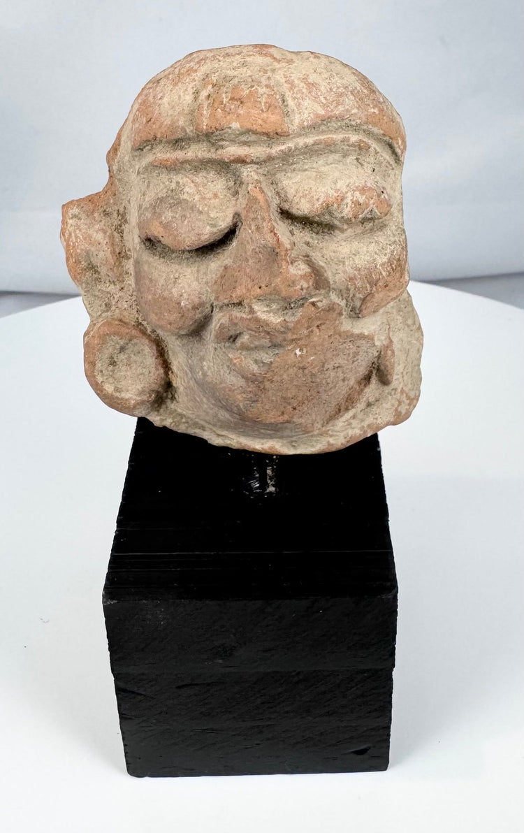 Weathered Pre-Columbian terracotta head fragment with burial accretions and surface patina