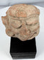 Ancient Mexican ceramic head with stylized facial features and possible headdress band