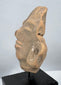 Museum-quality Pre-Columbian terracotta head mounted for display from a private collection.