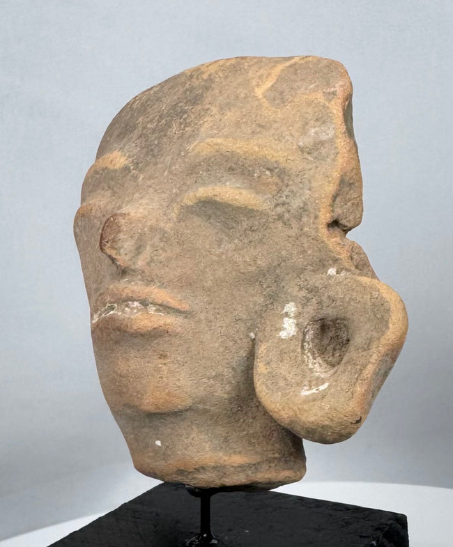 Historic Pre-Columbian ceramic head fragment displaying centuries of age and natural patina.