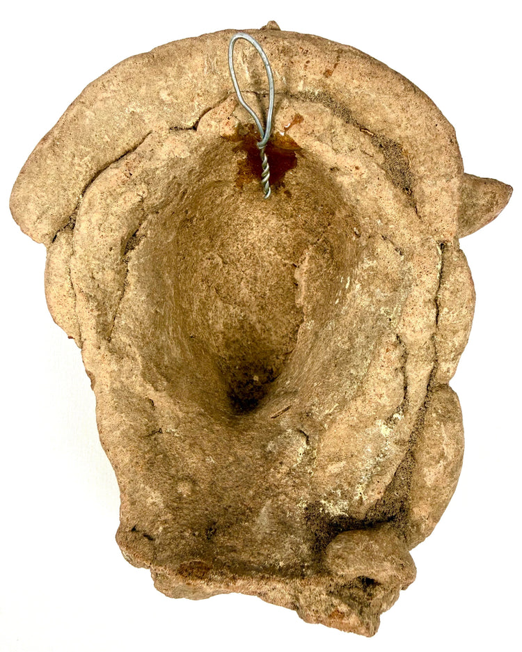 Rear view of hollow Pre-Columbian terracotta head showing mounting wire loop
