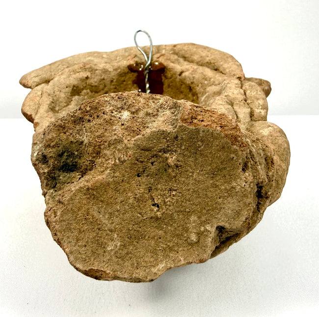 Back view of hollow terracotta head sculpture with hanging wire attachment