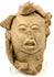 Frontal view of ancient Pre-Columbian terracotta head artifact with complex crown