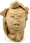 Frontal view of ancient Pre-Columbian terracotta head artifact with complex crown