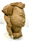 Three-quarter angle of ceremonial terracotta head with ornate crown-like headdress