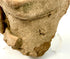 Macro detail of rough granular texture on Pre-Columbian terracotta head base