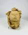 Ancient clay head from Pre-Columbian cultures with carved features and pigment traces