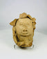 Ancient clay head from Pre-Columbian cultures with carved features and pigment traces