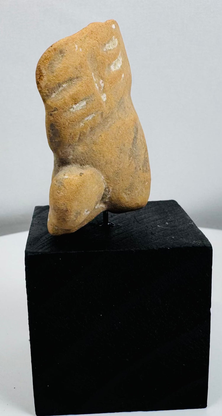 Pre-Columbian anthropomorphic terracotta head fragment exhibiting weathering consistent with long-term burial.