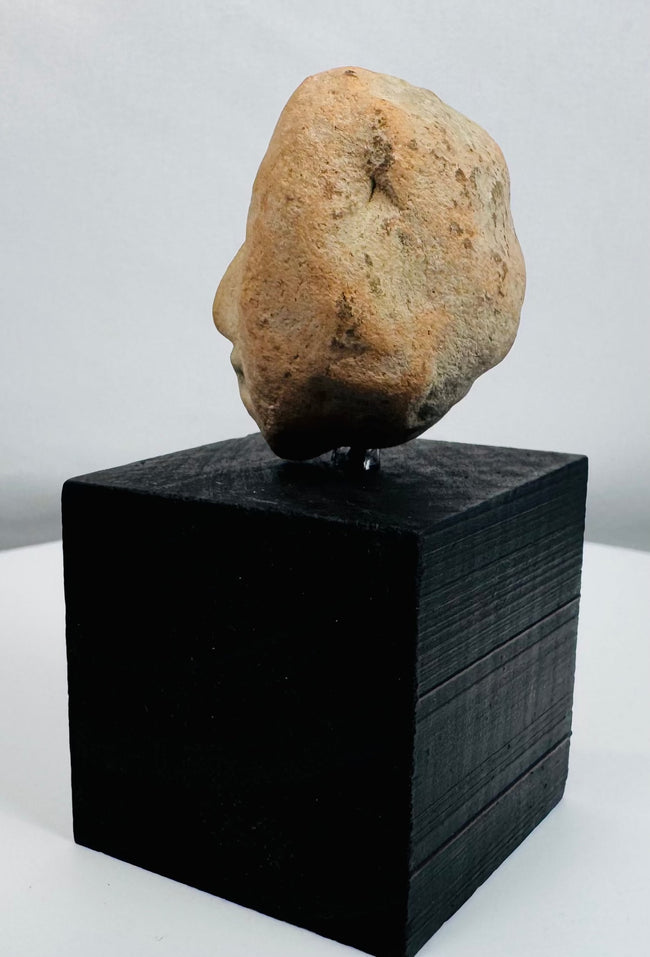 Pre-Columbian ceramic effigy fragment with burial patina and mineral deposits consistent with age.