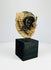 Pre-Columbian Mesoamerican mask with traces of black pigment and stylized animal face