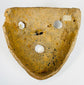 Mesoamerican clay mask with bold features and burial encrustation