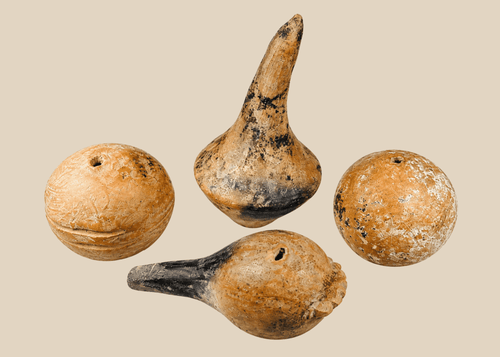 Group of four authentic Pre-Columbian terracotta ritual rattles with hollow forms and earthen burial patina.