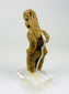 Pre-Columbian West Mexican ceramic figure displaying stylized proportions and ceremonial headdress