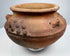 Ancient American ceramic vessel with hand-modeled surface decoration and natural archaeological patina.