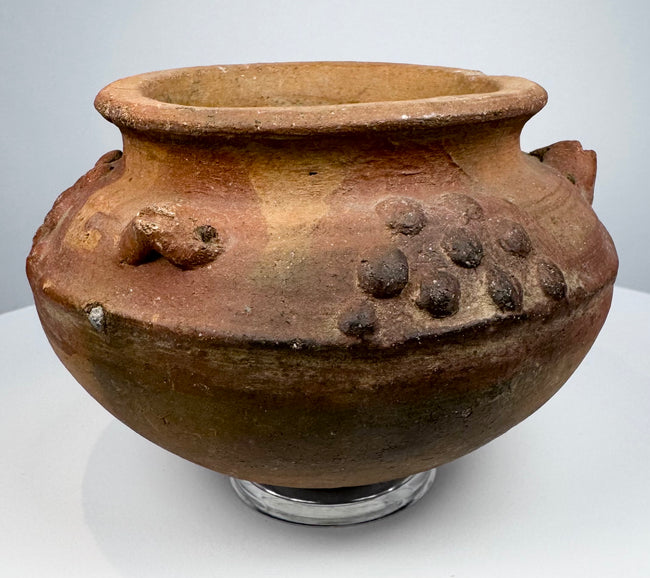 Pre-Columbian terracotta vessel from Central or South America, circa 800–1500 CE, with raised decorative clusters and reddish-brown patina.