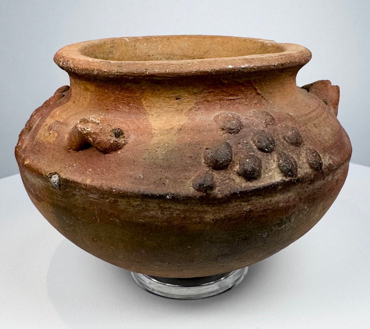 Pre-Columbian terracotta vessel from Central or South America, circa 800–1500 CE, with raised decorative clusters and reddish-brown patina.