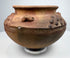 Pre-Columbian clay vessel, circa 800–1500 CE, with reddish-brown earthenware body and decorative relief elements.