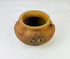 Ancient Mesoamerican or Andean clay vessel with raised decorative clusters