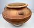 Historic Pre-Columbian pottery artifact with sculpted clusters, textured decoration, and centuries-old surface wear.